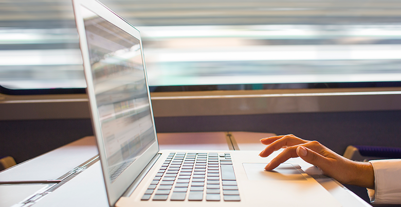 woman's hand on laptop computer